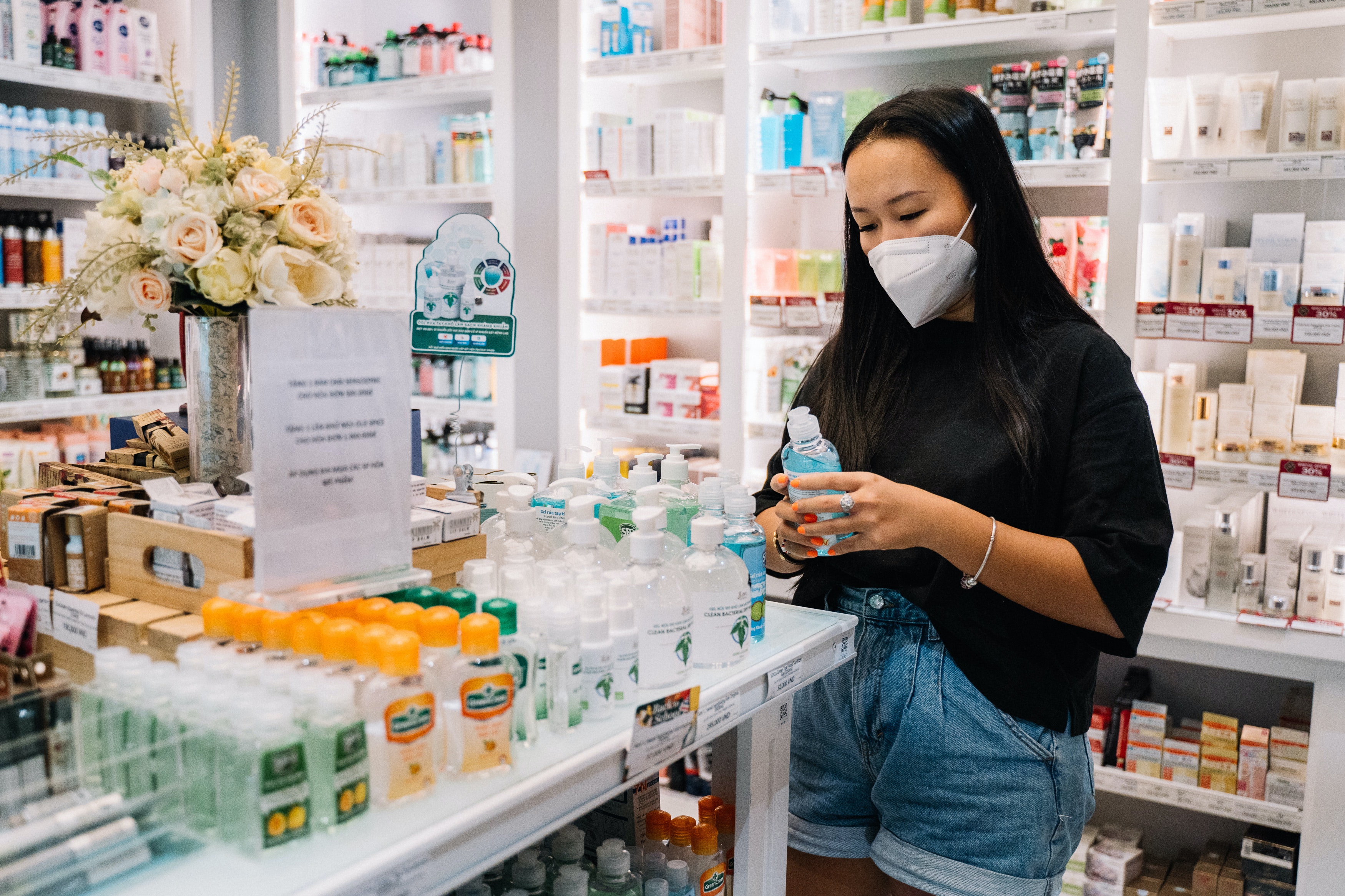 Girl in pharmacy looking at products